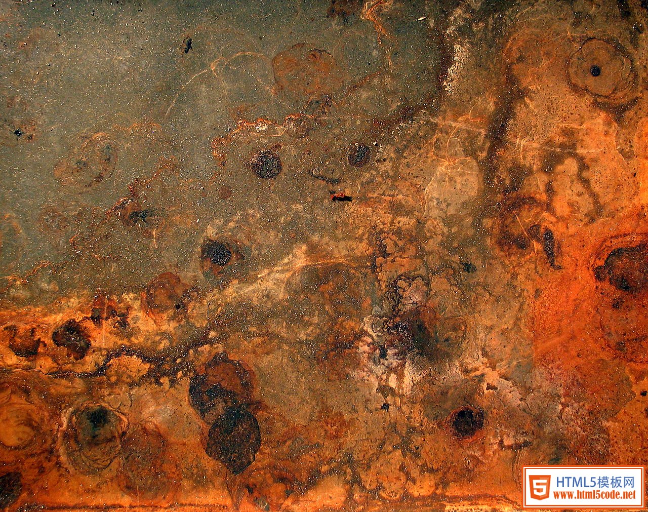 A photograph of rust and dirt.